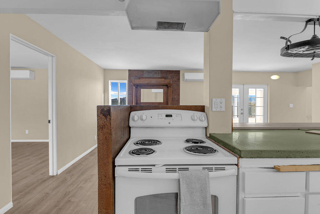 51088 Mecca Road Morongo Valley, CA 92256 - Photo 26 of 77 a kitchen with a stove and a refrigerator