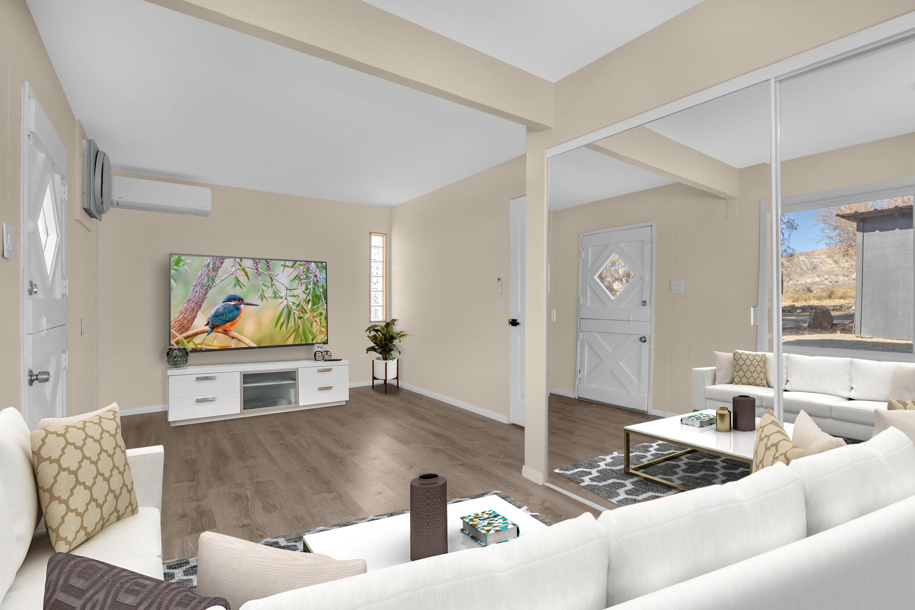 51088 Mecca Road Morongo Valley, CA 92256 - Photo 34 of 77 a living room with furniture and a flat screen tv