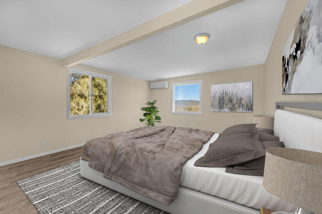 51088 Mecca Road Morongo Valley, CA 92256 - Photo 51 of 77 a bedroom with a bed and a couch