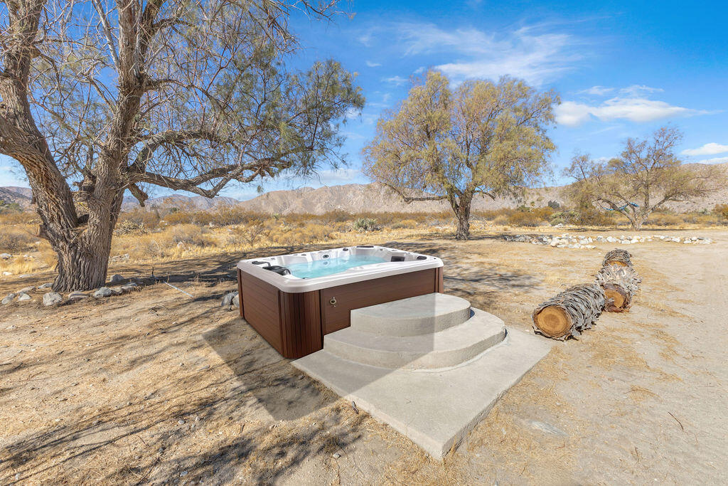 51088 Mecca Road Morongo Valley, CA 92256 - Photo 60 of 77 a view of a yard with an outdoor space