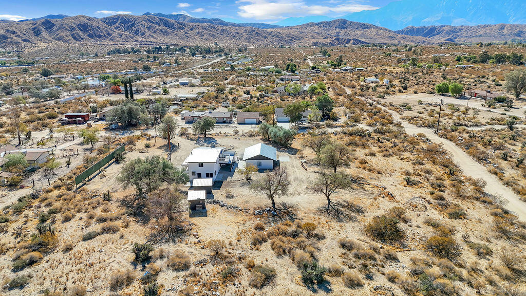 51088 Mecca Road Morongo Valley, CA 92256 - Photo 6 of 77 an aerial view of residential house and sandy dunes