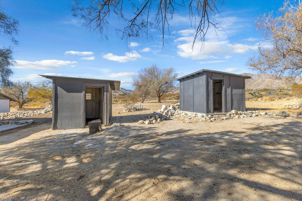 51088 Mecca Road Morongo Valley, CA 92256 - Photo 68 of 77 a view of a house with a snow in the yard