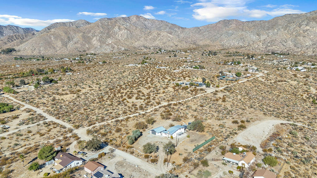51088 Mecca Road Morongo Valley, CA 92256 - Photo 75 of 77 a view of a dry yard with mountains in the background