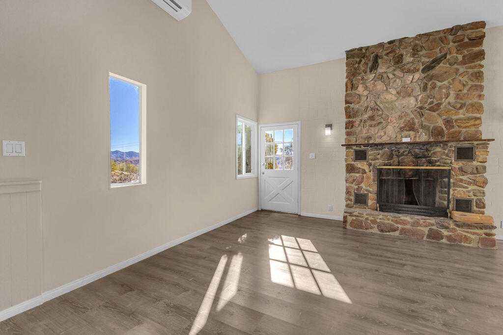 51088 Mecca Road Morongo Valley, CA 92256 - Photo 10 of 77 an empty room with windows and fireplace