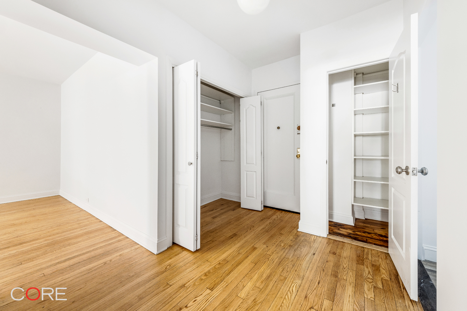 34-21 78th Street, Unit 2B Queens, NY 11372 - Photo 5 of 9 a view of hallway with wooden floor