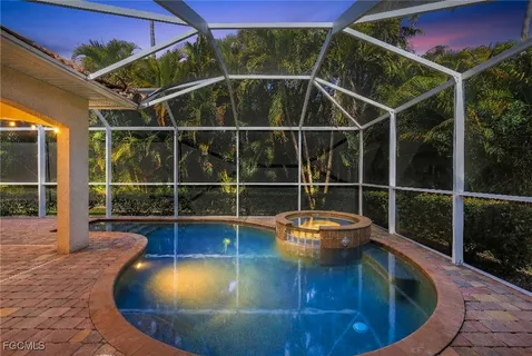 a view of a swimming pool with a porch