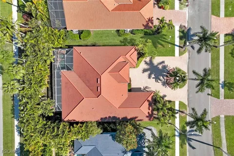 an aerial view of a house with a yard