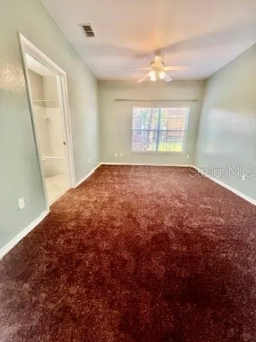 a view of a bathroom with a sink and a mirror