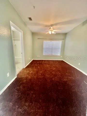 a bathroom with a toilet sink and a mirror