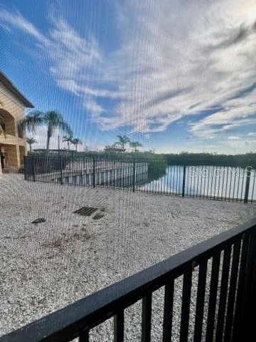 a view of balcony with wooden floor