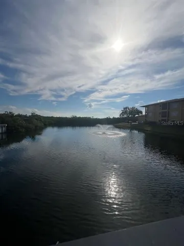 a bedroom with a bed couch and window