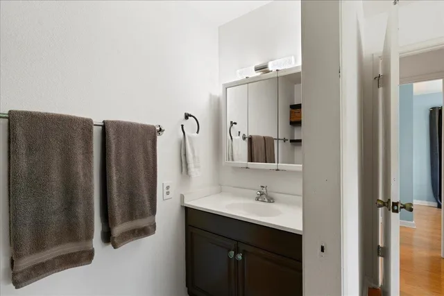 a bathroom with a double vanity sink and mirror