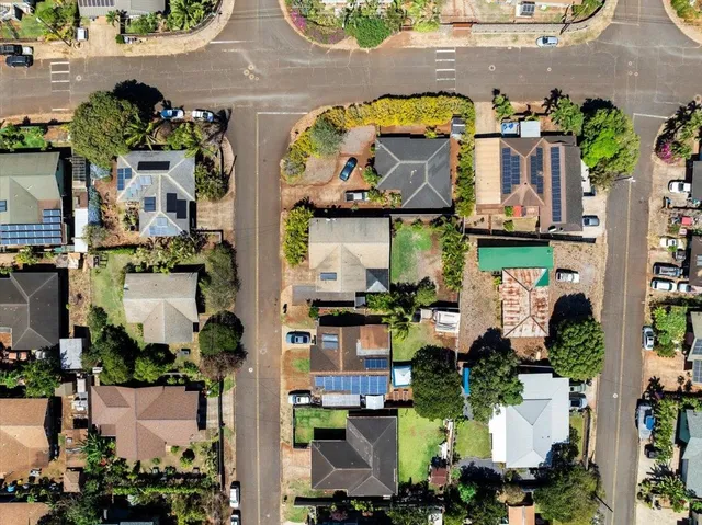 an aerial view of residential houses and outdoor space