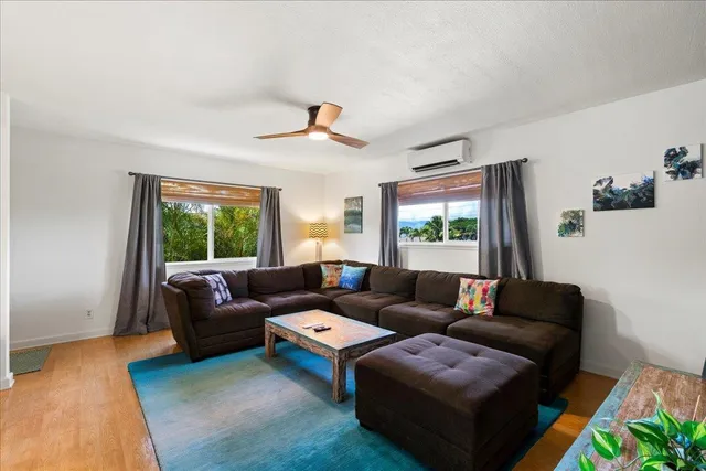 a living room with furniture and a window