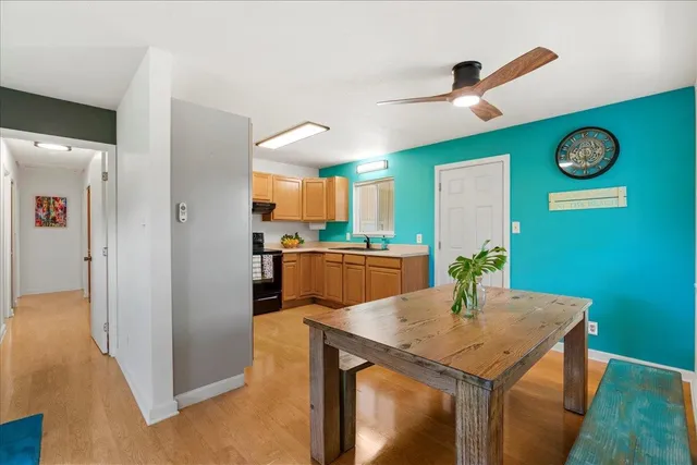 a kitchen with a table and chairs