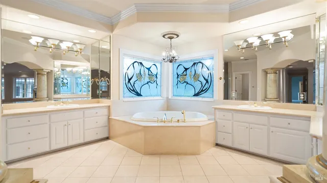 a bedroom with double bed and a large window