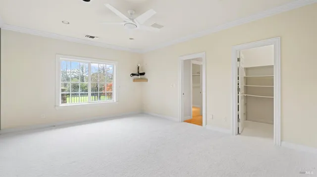 a bathroom with a glass shower door and a sink