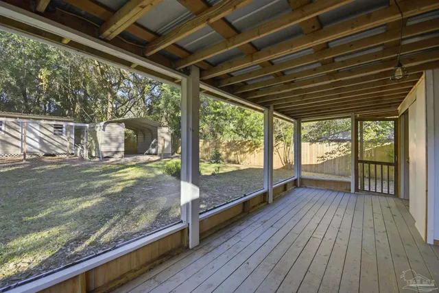 a view of a balcony with wooden floor