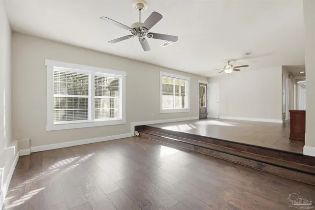 a view of room with window and hardwood floor