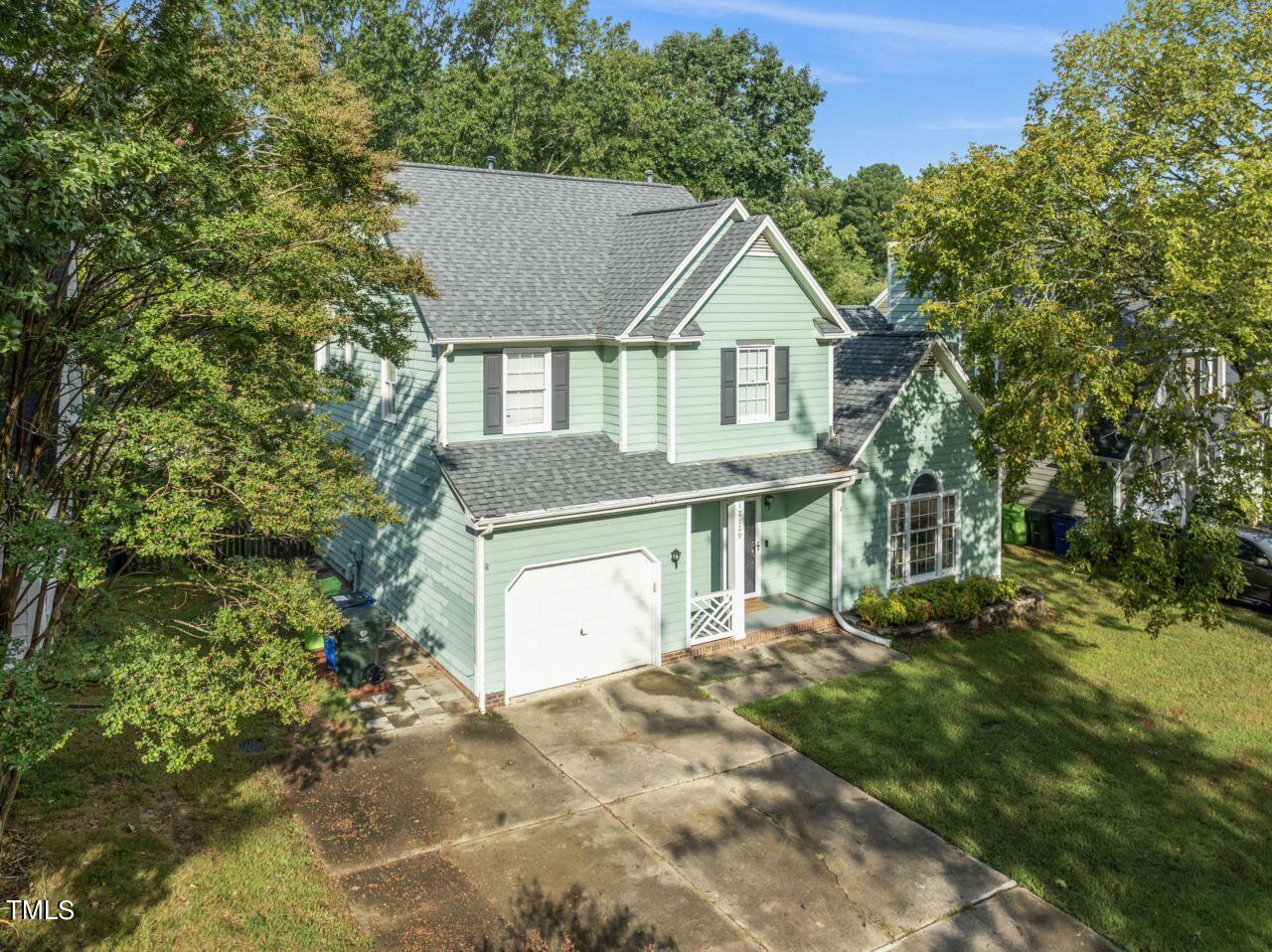 12129 Mabledon Court Raleigh, NC 27613 - Photo 1 of 31 a front view of a house with a yard and garage