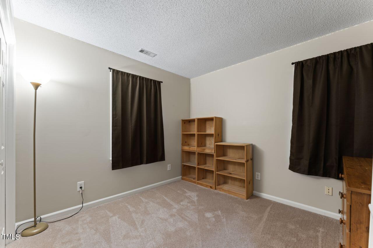 12129 Mabledon Court Raleigh, NC 27613 - Photo 24 of 31 a view of room with walk in closet