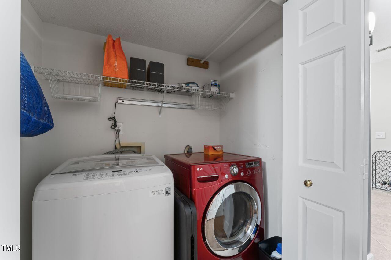 12129 Mabledon Court Raleigh, NC 27613 - Photo 26 of 31 a utility room with dryer and washer