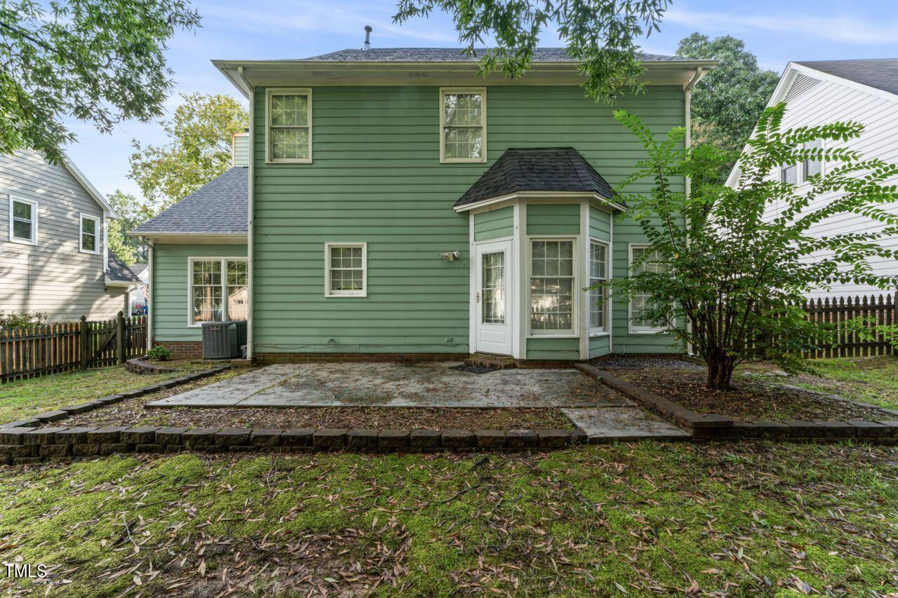 12129 Mabledon Court Raleigh, NC 27613 - Photo 27 of 31 a front view of a house with garden