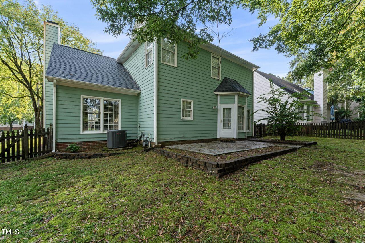 12129 Mabledon Court Raleigh, NC 27613 - Photo 28 of 31 a backyard of a house with table and chairs