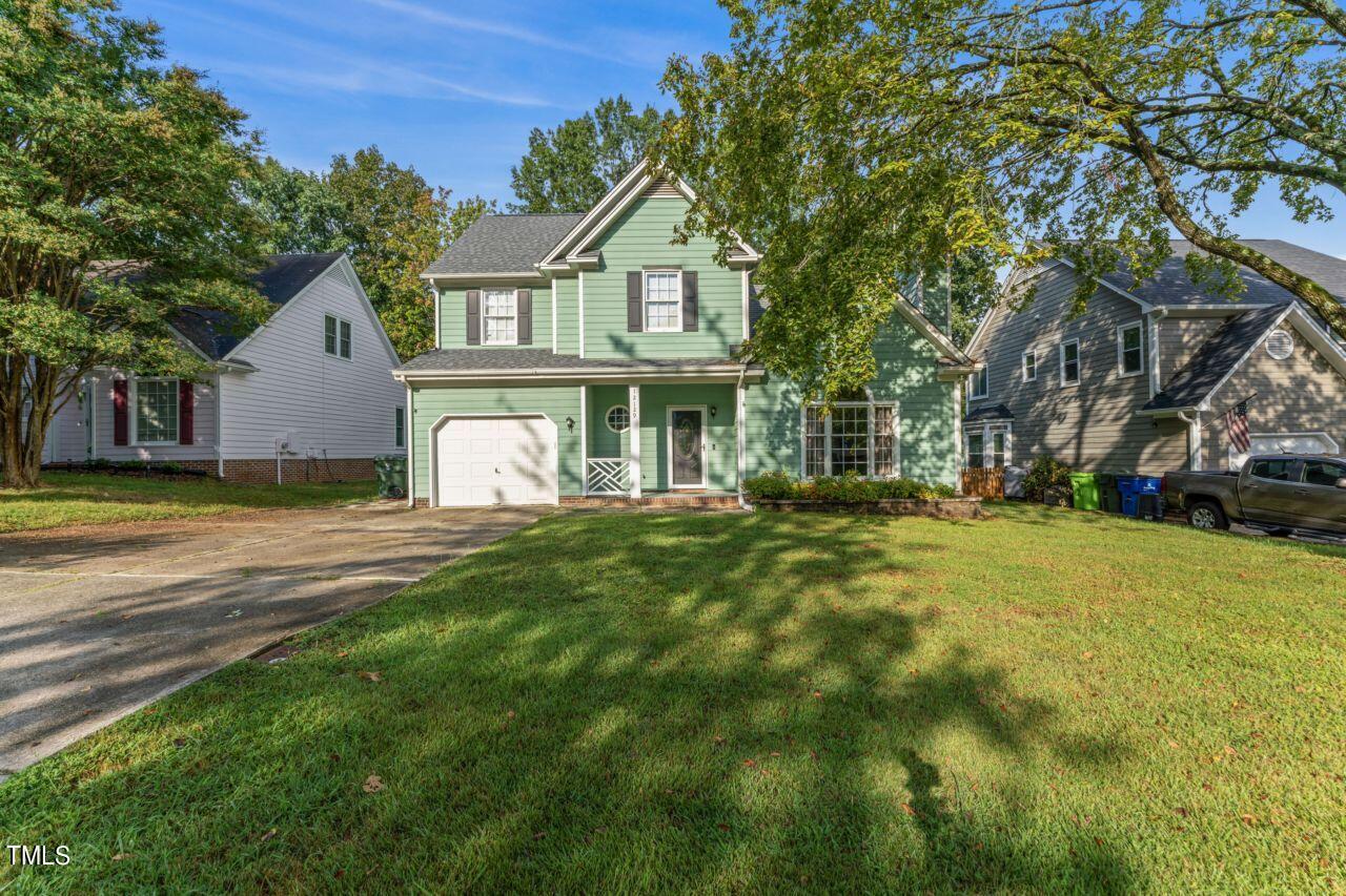 12129 Mabledon Court Raleigh, NC 27613 - Photo 3 of 31 a front view of a house with a garden