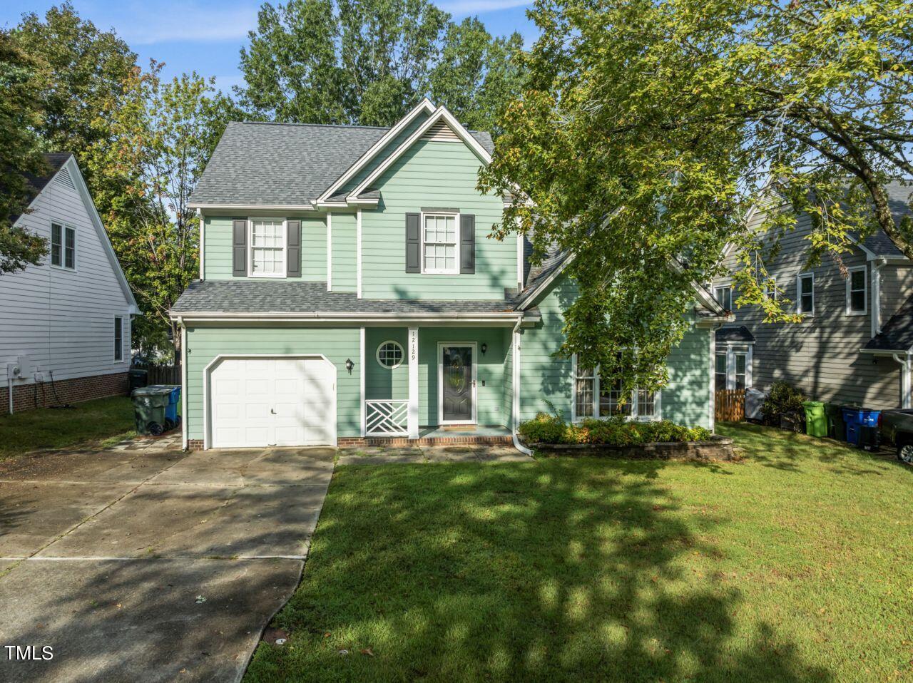 12129 Mabledon Court Raleigh, NC 27613 - Photo 31 of 31 a front view of a house with a yard