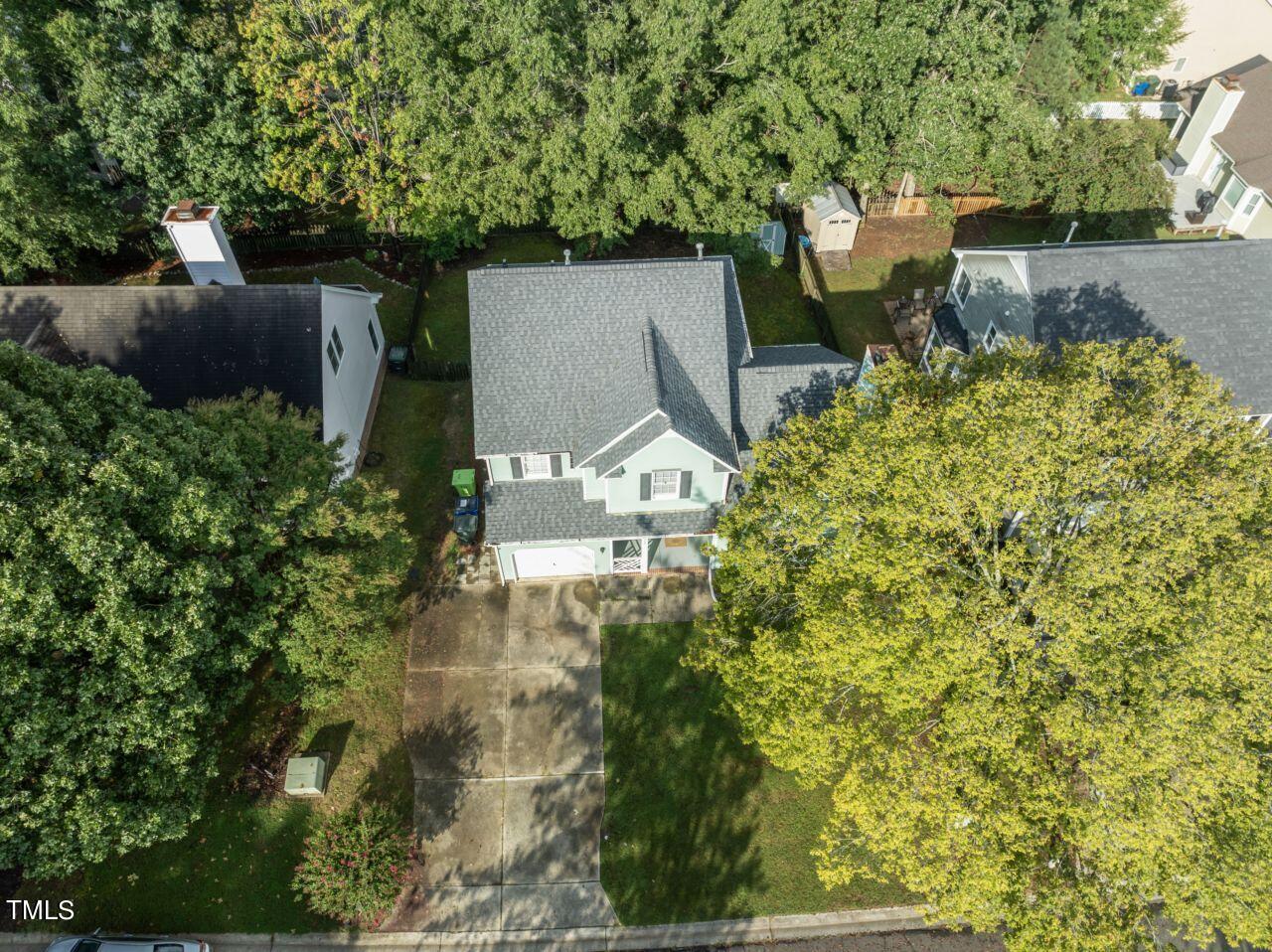 12129 Mabledon Court Raleigh, NC 27613 - Photo 4 of 31 an aerial view of a house with a yard basket ball court and outdoor seating
