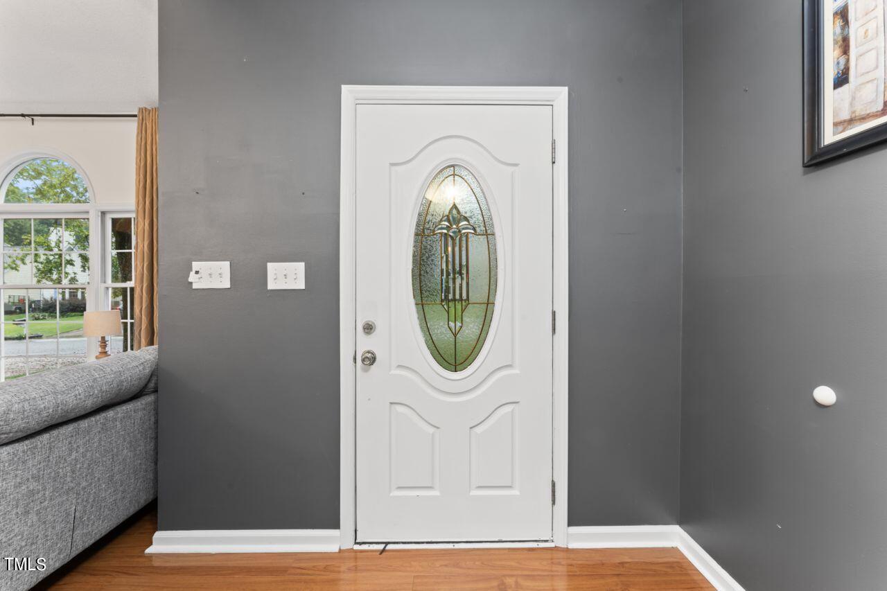 12129 Mabledon Court Raleigh, NC 27613 - Photo 6 of 31 a front view of a house with a garden