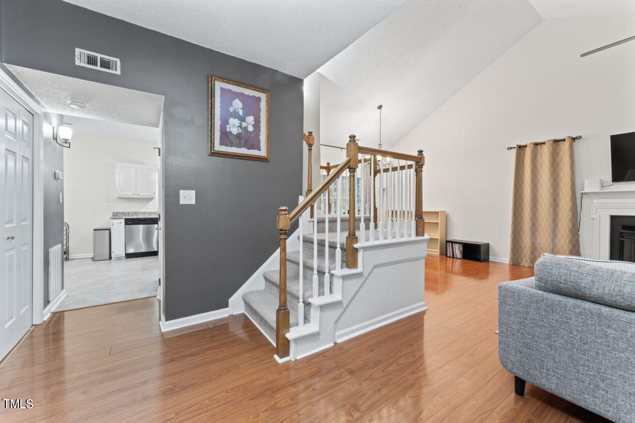12129 Mabledon Court Raleigh, NC 27613 - Photo 8 of 31 a view of a livingroom with furniture and stairs