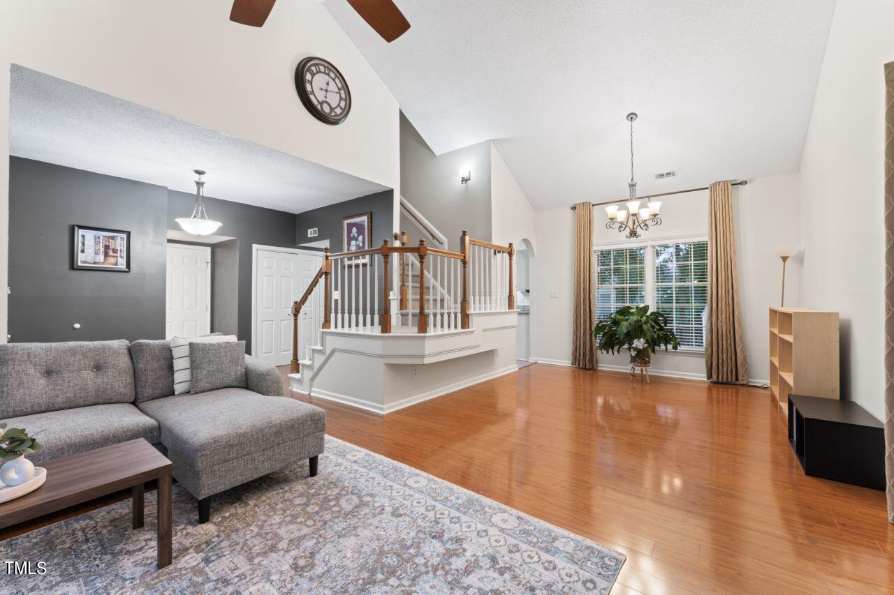 12129 Mabledon Court Raleigh, NC 27613 - Photo 9 of 31 a living room with furniture and a large window