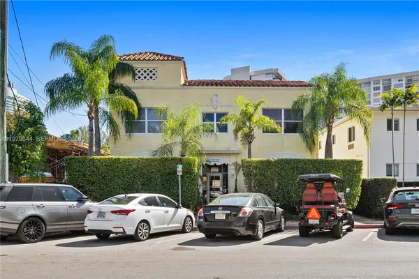 a view of a car parked in front of a house