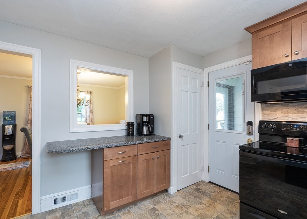 36 Mayfield Street Springfield, MA 01108 - Photo 11 of 34 a kitchen with granite countertop a sink and cabinets