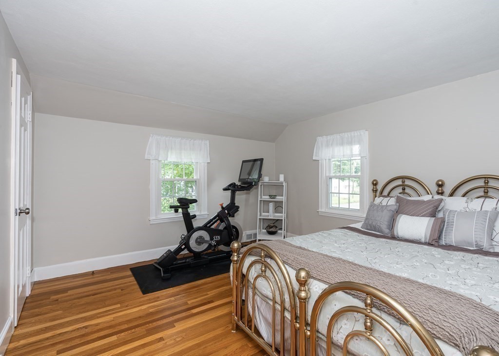 36 Mayfield Street Springfield, MA 01108 - Photo 20 of 34 a bedroom with a bed and a dresser next to a window