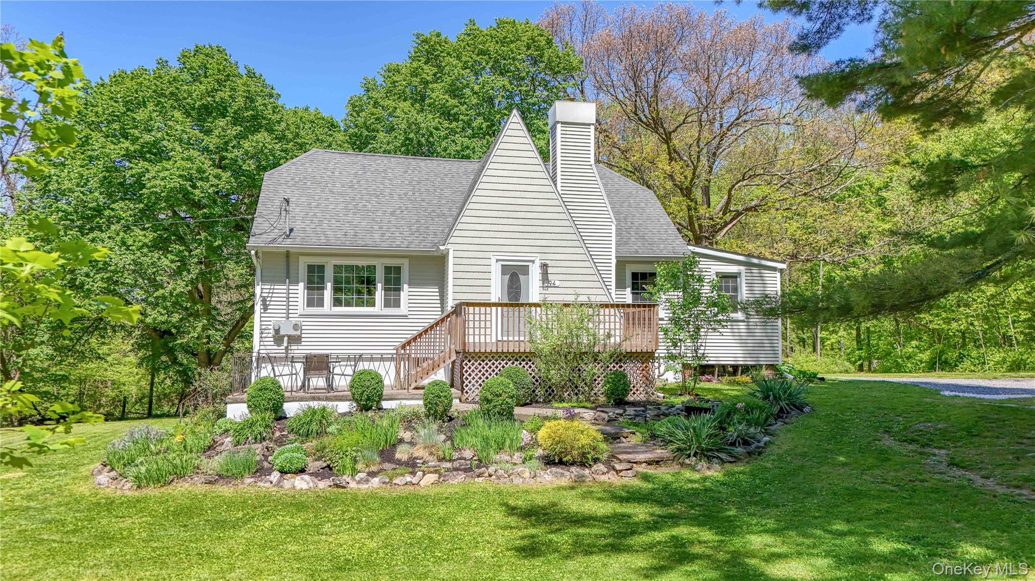 94 Smithtown Road Fishkill, NY 12524 - Photo 1 of 45 a house that has a lot of plants in it