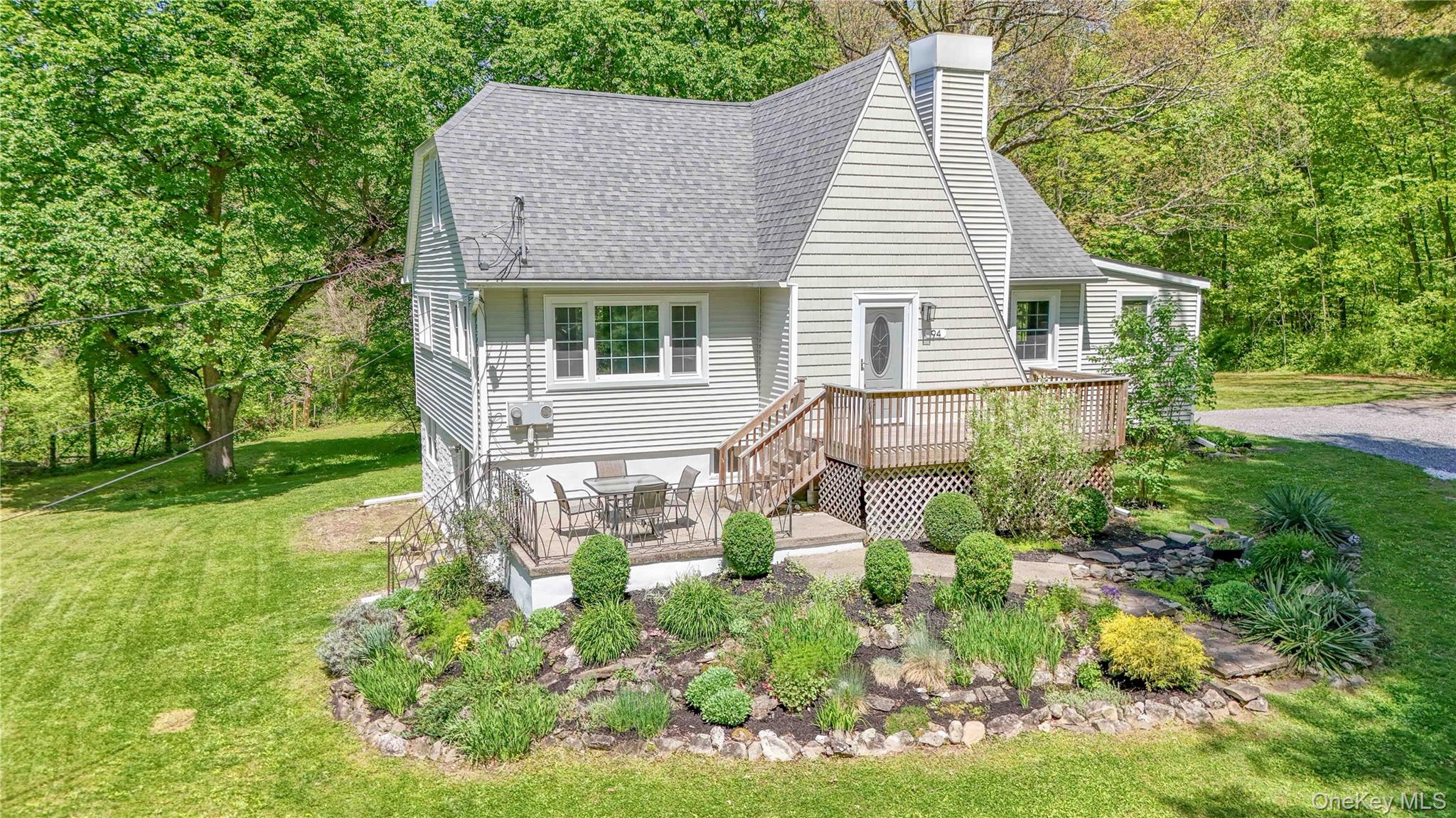 94 Smithtown Road Fishkill, NY 12524 - Photo 11 of 45 a front view of a house with garden