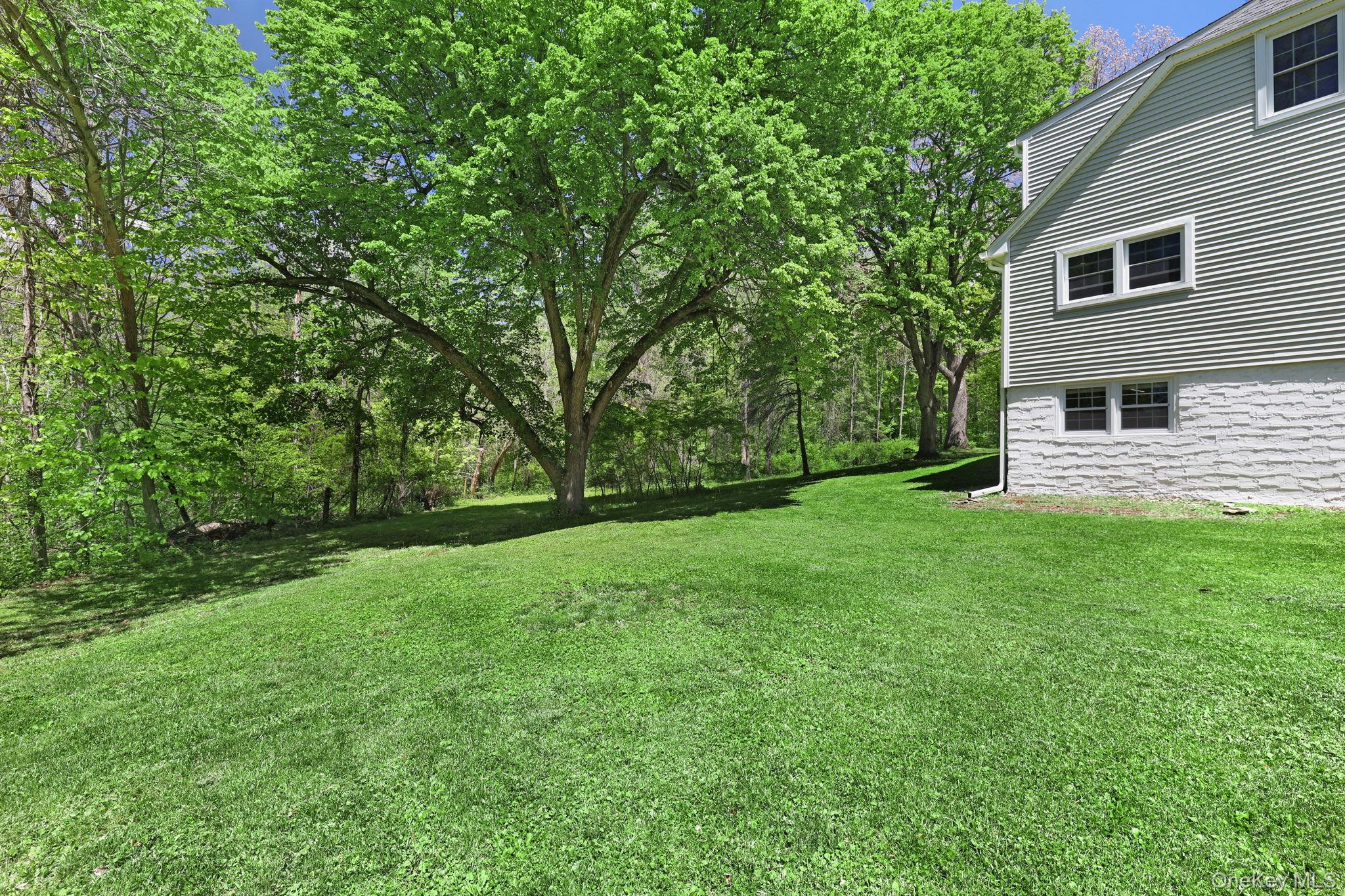 94 Smithtown Road Fishkill, NY 12524 - Photo 16 of 45 a view of a backyard with a garden