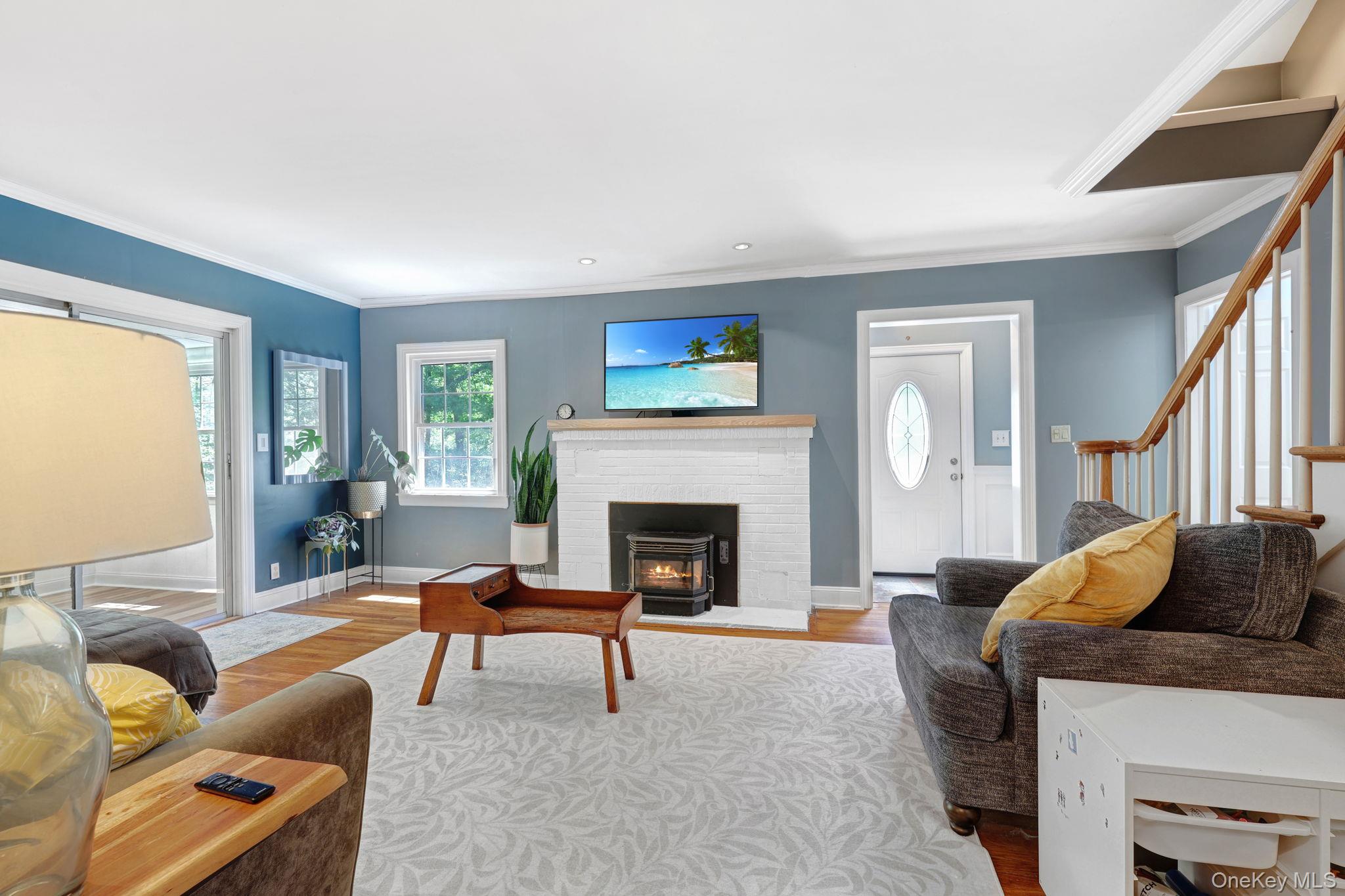 94 Smithtown Road Fishkill, NY 12524 - Photo 21 of 45 a living room with furniture and a fireplace