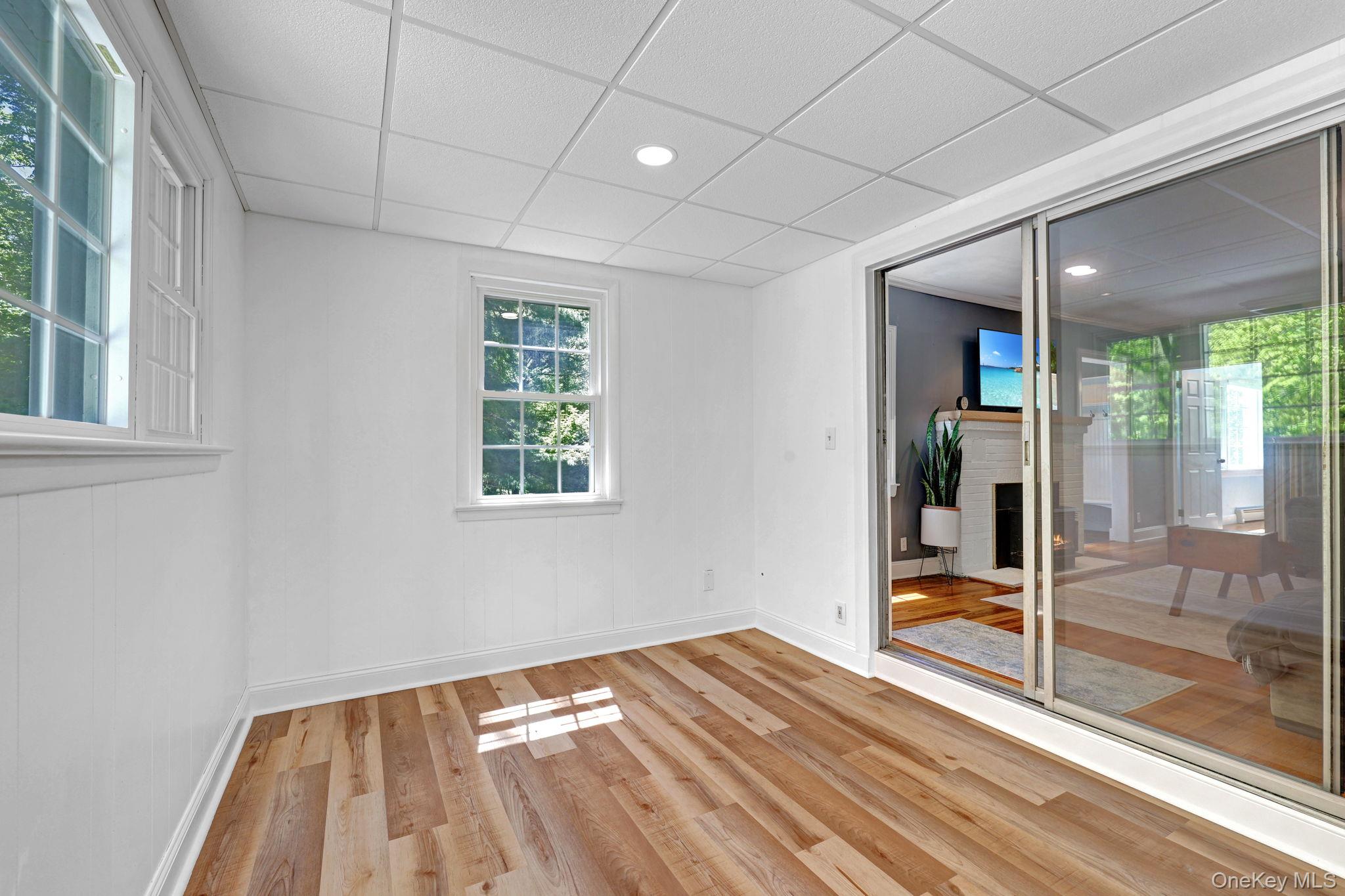 94 Smithtown Road Fishkill, NY 12524 - Photo 23 of 45 a view of empty room with wooden floor and fan