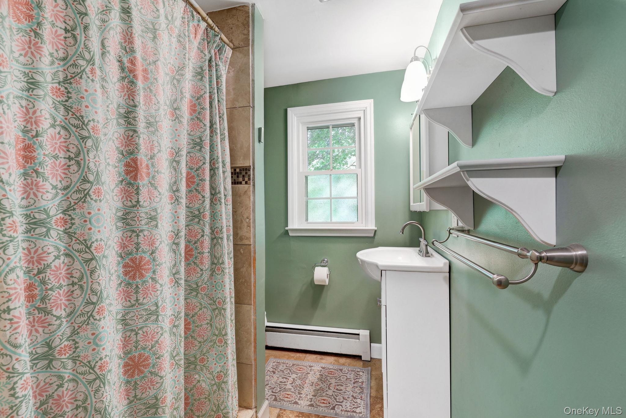 94 Smithtown Road Fishkill, NY 12524 - Photo 41 of 45 a bathroom with a sink and a mirror