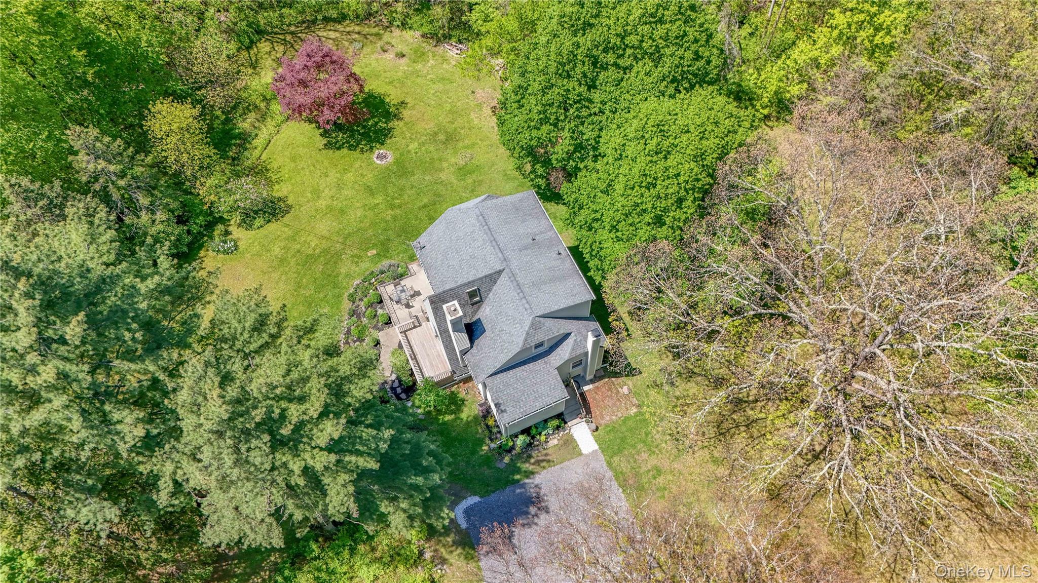 94 Smithtown Road Fishkill, NY 12524 - Photo 10 of 45 a aerial view of a house with a yard and large trees