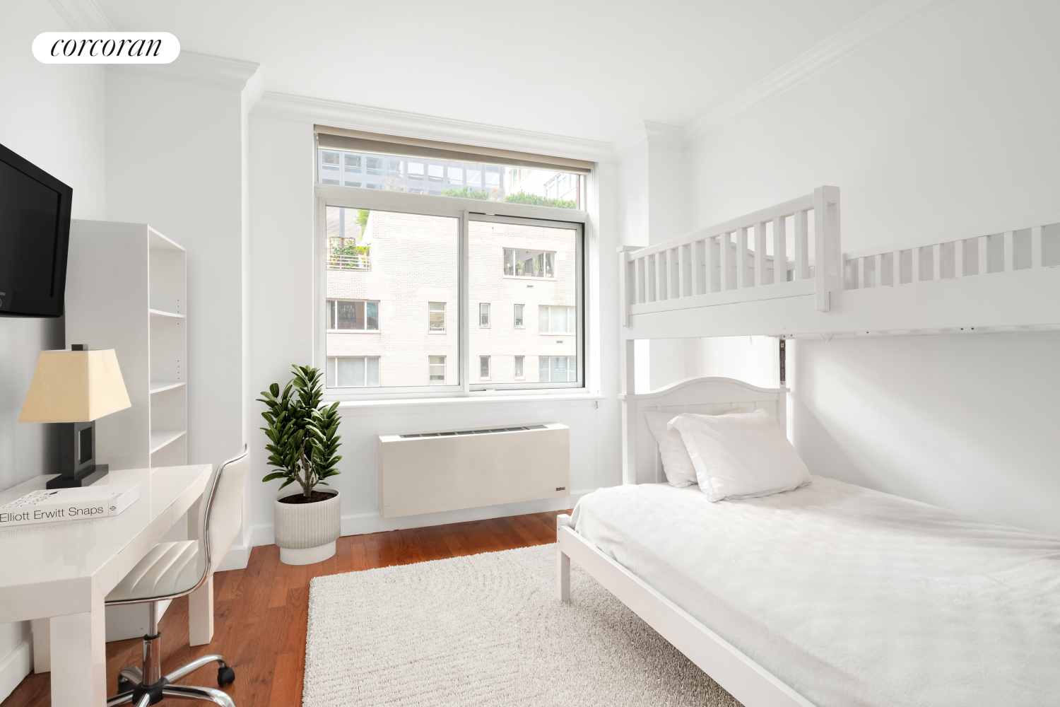 212 East 57th Street, Unit 8C Manhattan, NY 10022 - Photo 8 of 11 a bedroom with a large bed and a potted plant