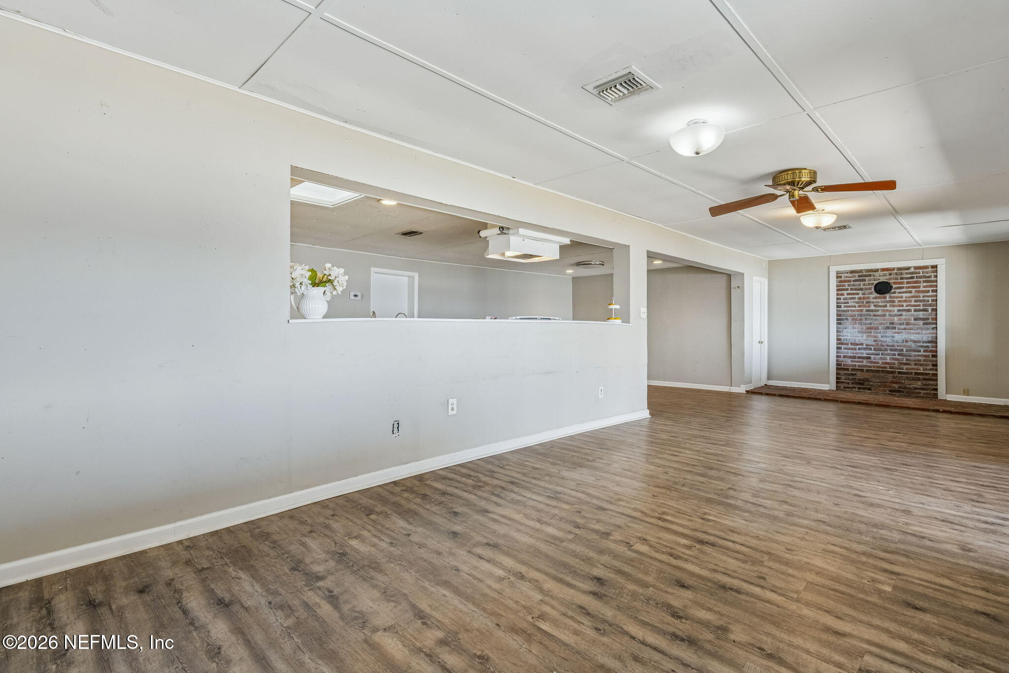 8528 Moody Canal Road St. Augustine, FL 32092 - Photo 16 of 61 a view of empty room with wooden floor