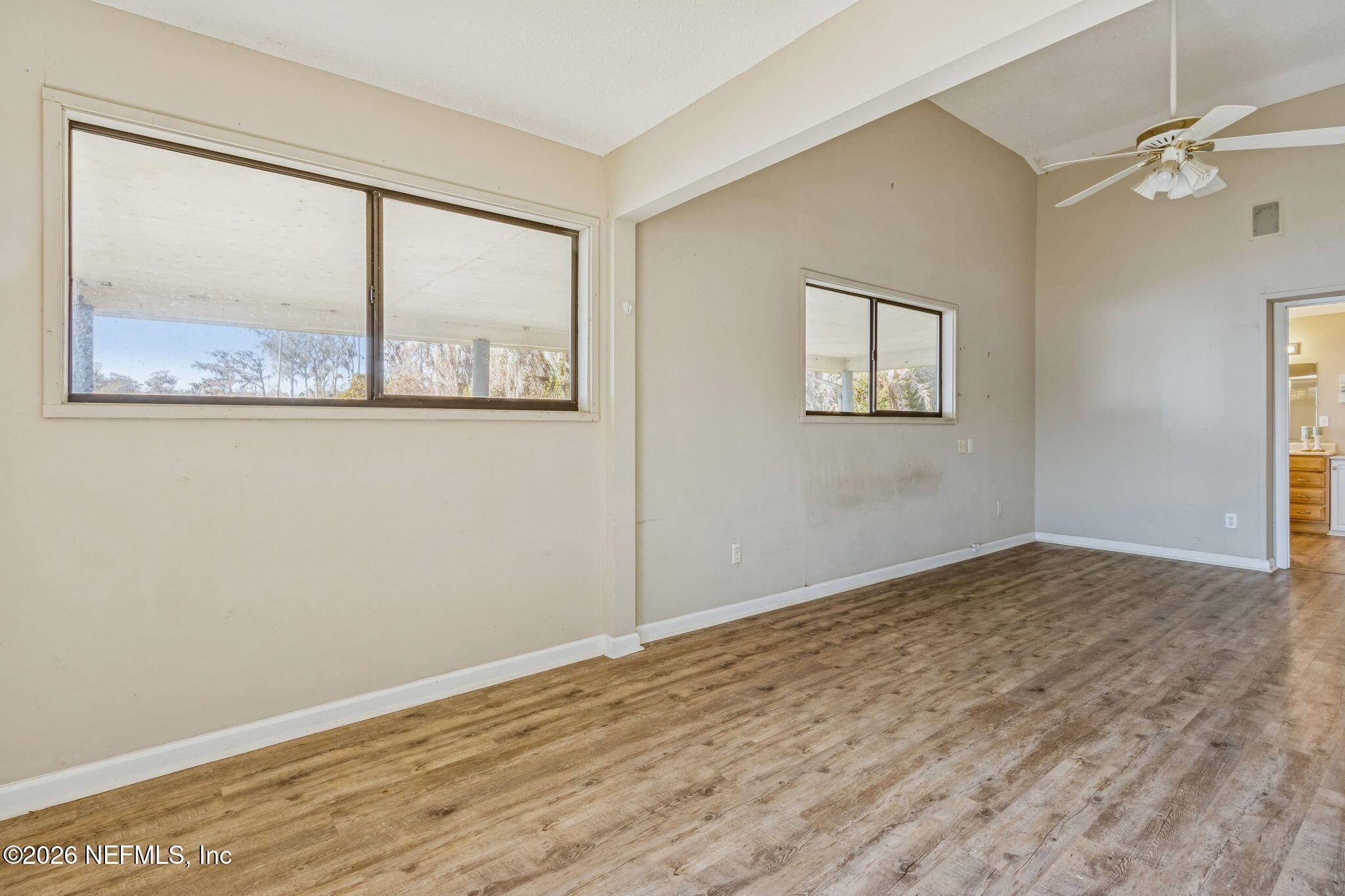 8528 Moody Canal Road St. Augustine, FL 32092 - Photo 20 of 61 an empty room with a window