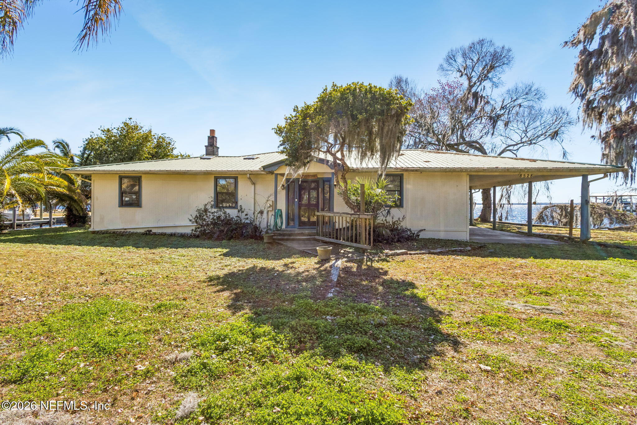 8528 Moody Canal Road St. Augustine, FL 32092 - Photo 2 of 61 a front view of a house with a yard