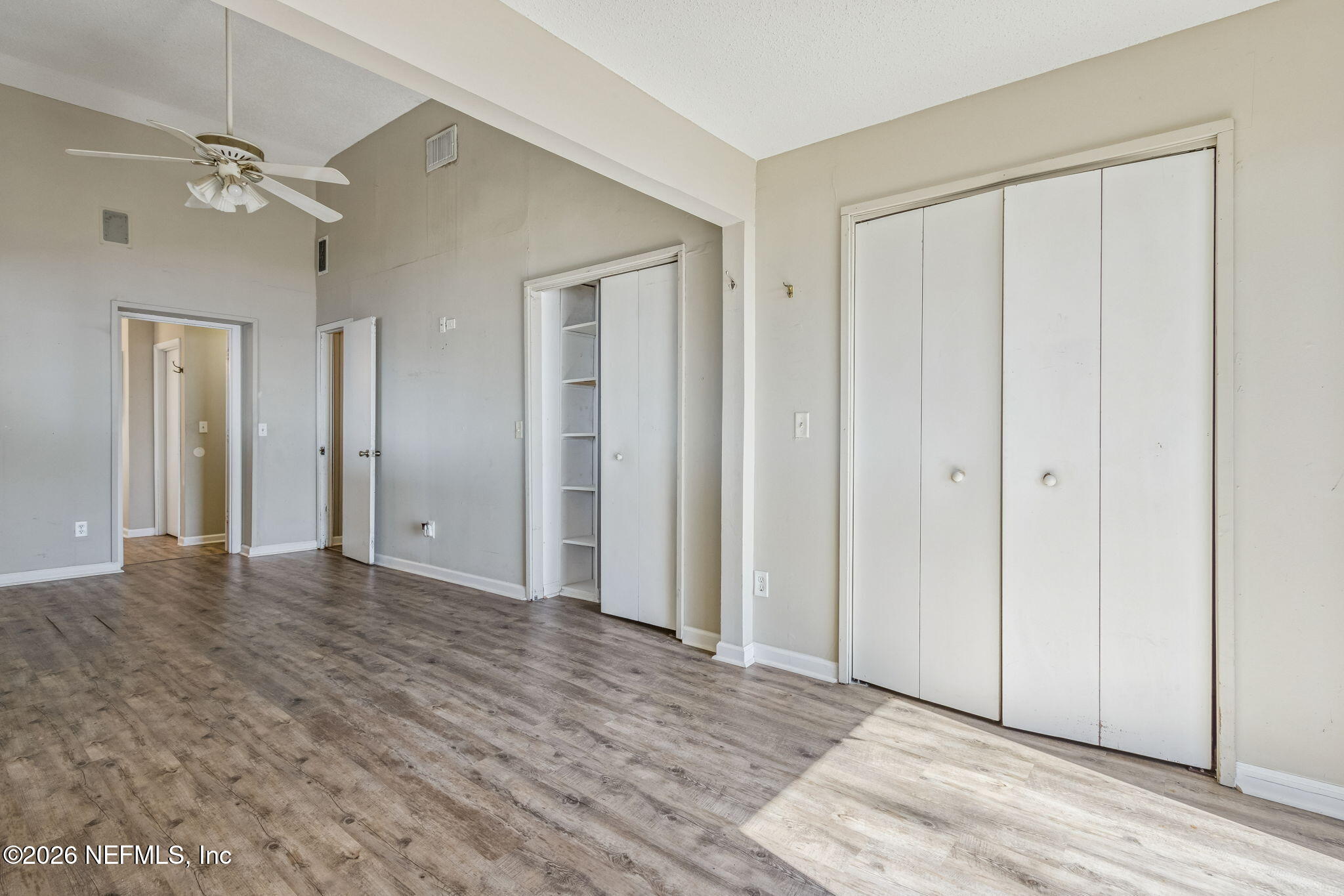 8528 Moody Canal Road St. Augustine, FL 32092 - Photo 21 of 61 a view of an empty room with wooden floor