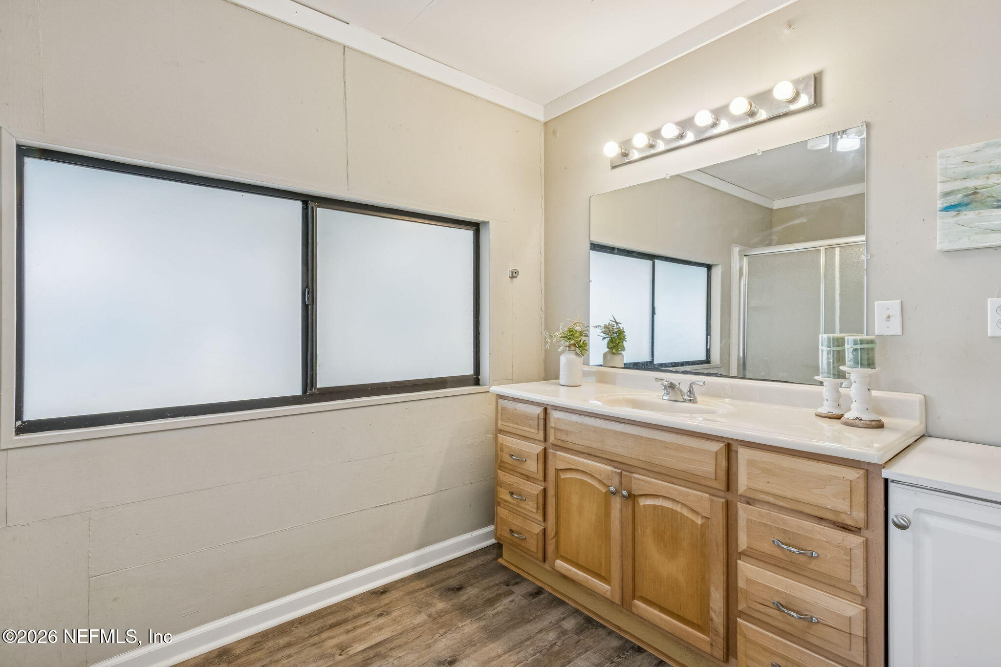 8528 Moody Canal Road St. Augustine, FL 32092 - Photo 22 of 61 a spacious bathroom with a double vanity sink and a mirror